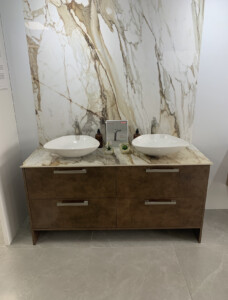 A table with cabinets and two bowls kept on top