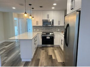 A modern kitchen of a house with a mirror